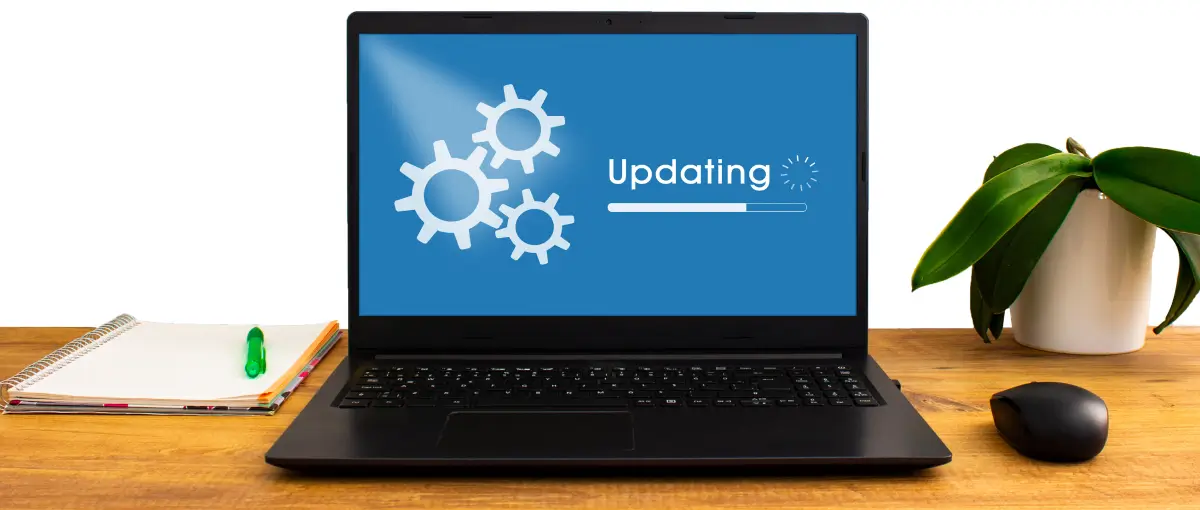 An image of a laptop with a screen representing a software update.